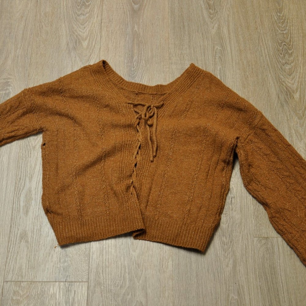 A brown yarn sweater.